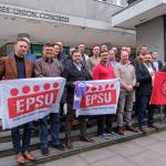 Firefighters from across Europe hold an EPSU banner outside Trades Congress House