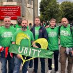 Steve Wright and FBU officials hold a 'unity' placard at the Grenfell silent walk