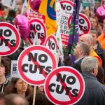 Protestors hold 'no cuts' placards