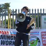 Paula Dunne of Strike Map with a megaphone at the bin strike picket line