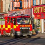 A fire engine in Blackpool outside a colourful arcade