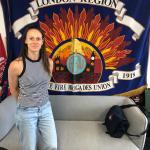 Annabel Green in front of the Fire Brigades Union national banner