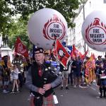 FBU piper with FBU balloons at rally