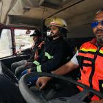 Two firefighter driving a fire appliance with a cracked windscreen