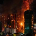A huge fire rages across multiple apartment blocks